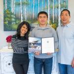 Koda Robinson, center, between his parents Atra and Kim Robinson, is bound for the United States Naval Academy at the end of June. Sequim Gazette photo by Emily Matthiessen