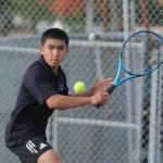 File photo
Sequims Koda Robinson looks to hit a backhand in his two-set win over North Kitsaps Indigo Gallagher in October 2021.