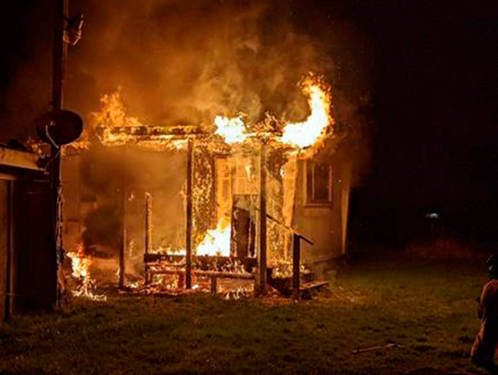 Photo by Mike Mingee/ Clallam County Fire District 3
This house was deemed a total loss after a fire on Feb. 13. Clallam County Fire District 3 firefighters helped rescue its lone resident that night.