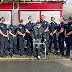 Sequim Gazette photo by Matthew Nash
Clallam County Fire District 3 firefighters meet with Gregg Vella last week for the first time weeks after rescuing him from a house fire. Pictured from, left, are firefighter/EMT Jaisal White; firefighter/paramedic Len Horst; Capt. Stef Anderson; firefighter/paramedic Chase Laubach; Capt. Kjel Skov; Vella; firefighter/paramedic Mark Mullvain; Capt. Joel McKeen; firefighter/EMT Jared Romberg; firefighter/paramedic Casey Sires; firefighter/paramedic Jack Hueter.