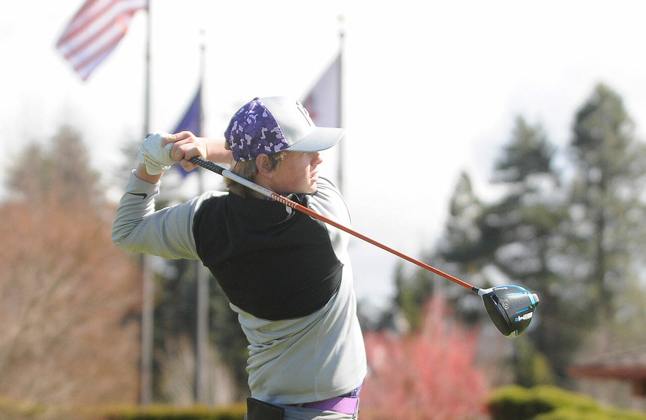 File photos
Sequims Ben Sweet tees off on the first hole in an Olympic League golf match in April 2021.