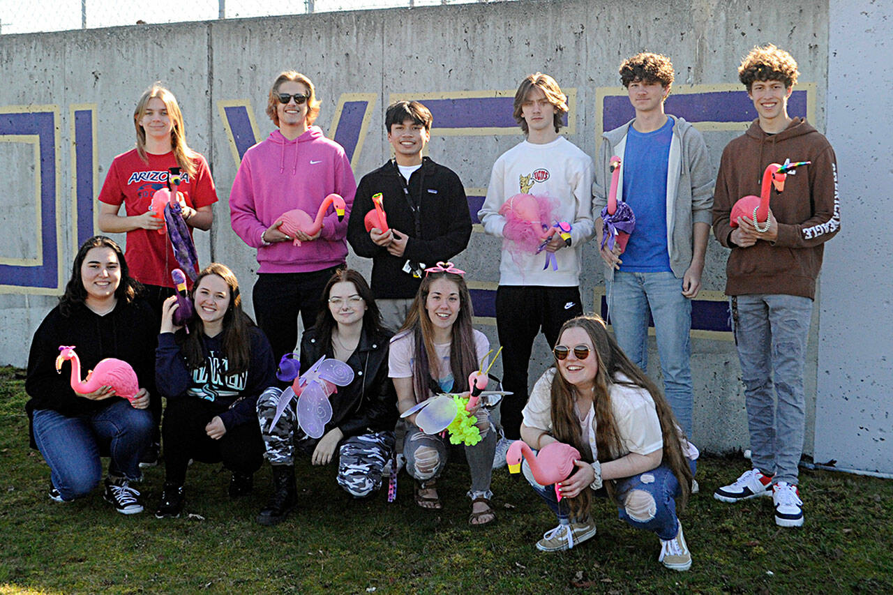 Matthew Nash | Sequim Gazette
The fundraiser for Sequim Highs Class of 2022 graduation party placing flamingos on lawns started last Sunday. Pictured on the first night, are from top left, Tyler Lawson, Harrison Bell, Kristian Mingoy, Kaden Sleeper, Duke Anderson, Adrian Brown; bottom left, Alisa Bibaj, Desara Bibaj (sophomore), Madison McKeown, Jordan Hegtvedt, and Abigail Carlson.