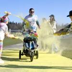 Cade Moses of Port Angeles and (almost) 5-year-old Cameryn enjoy a splash of yellow at the last color station at the Sun Fun Color Run 5k Saturday morning at the Albert Haller Playfields just north of Carrie Blake Community Park. More than 500 participants were registered to run/walk 5k and 1k race. Sequim Gazette photo by Michael Dashiell