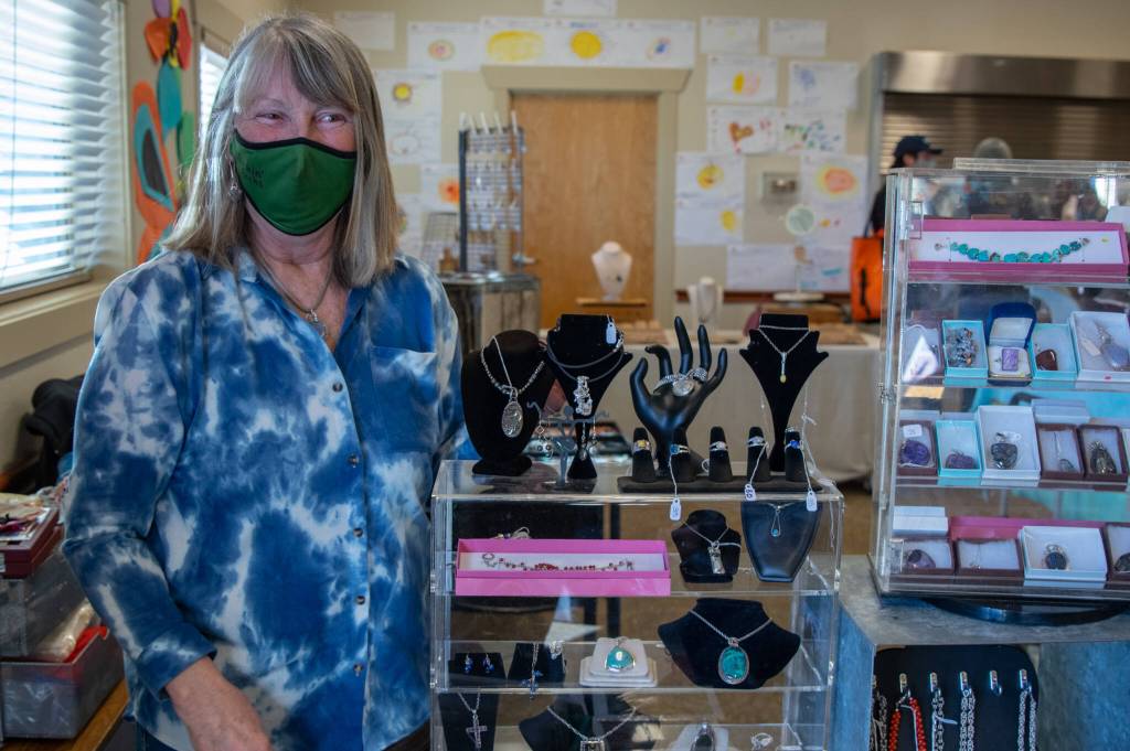 Suzy Killins of Rockin Rocks greets visitors at the Sunshine Market on Saturday. Sequim Gazette photo by Emily Matthiessen