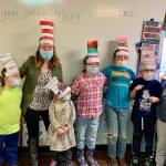 From left, Lincoln Gordeuk, teacher Tiffany Malean, Eliza Burrows Eryn Haubrick, Noah Rix, Taze Linden and Liam Johnson celebrate Read Across America Day. Submitted photo