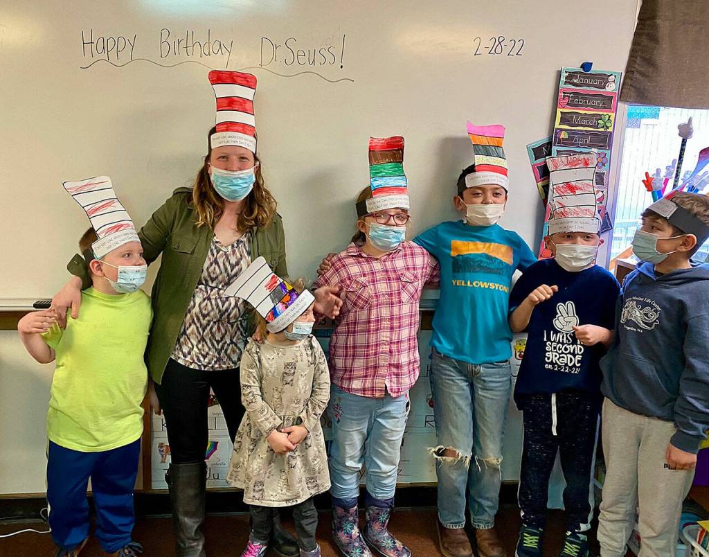 From left, Lincoln Gordeuk, teacher Tiffany Malean, Eliza Burrows Eryn Haubrick, Noah Rix, Taze Linden and Liam Johnson celebrate Read Across America Day. Submitted photo