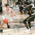 Peninsulas Jaylin Reed, left, is defended by Shorelines A.J. Boyd on March 9 at Peninsula College. Photo by Keith Thorpe/Olympic Peninsula News Group