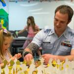Bella Wernofsky chooses stickers for a crown with her dad, Ryken Wernofsky, at Dungeness Community Churchs Toddler Prom in Sequim on March 11. I did a daddy-daughter dance with my oldest, and now it is this ones turn, said Wernofsky. I thought it would be a special night for her. Sequim Gazette photo by Emily Matthiessen
