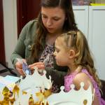 Johnnie Cooper and her daughter, Oaklee Cooper, three, choose stickers for a crown at the Dungeness Community Churchs Toddler Prom in Sequim on March 11. Were here just to celebrate her; I thought it would be fun to do something just for her, Johnnie Cooper. Sequim Gazette photo by Emily Matthiessen