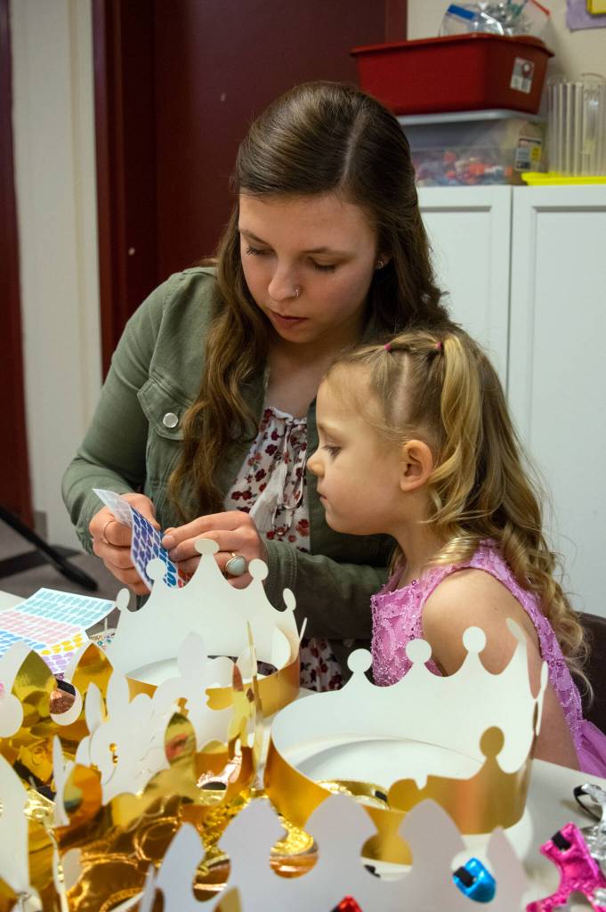 Johnnie Cooper and her daughter, Oaklee Cooper, three, choose stickers for a crown at the Dungeness Community Churchs Toddler Prom in Sequim on March 11. Were here just to celebrate her; I thought it would be fun to do something just for her, Johnnie Cooper. Sequim Gazette photo by Emily Matthiessen