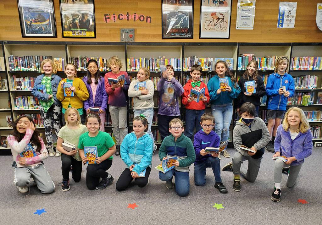 Courtesy photos
Helen Haller Elementarys Battle of the Books club prep to read The Cardboard Kingdom, the final book in the annual challenge.
