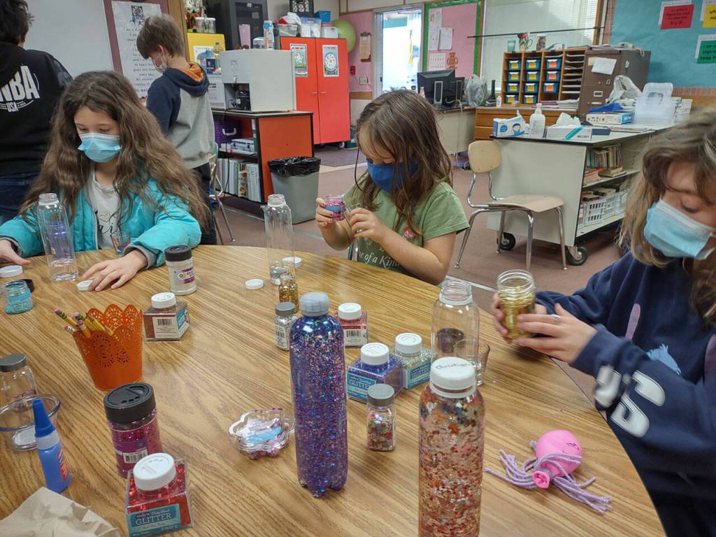 Students (from left) Natalie Tripp, Evelynn Moose and Isabel Lawson create calming glitter bottles in Heather Rileys class at Helen Haller Elementary School. Submitted photo