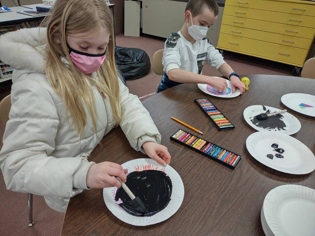 Madison Bell and Xavier Devlin create scratch paper art in Heather Rileys class at Helen Haller Elementary School.
