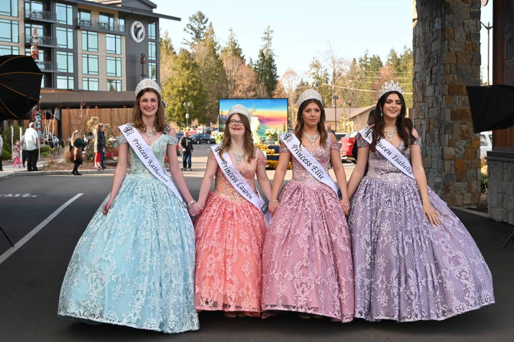Sequim Gazette photo by Michael Dashiell
2022 Sequim Irrigation Festival royalty prepare to see the festival float for the first time at the Kickoff Dinner & Auction at 7 Cedars Resort in Blyn on March 19. Pictured, from left, are princesses Katherine Gould, Lauren Willis and Ellie Turner, and queen Isabella Williams.