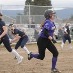 Sequims Hannah Bates, right, looks to beat out a bunt for a hit as Sequims Wolves knock off visiting 1A Forks 12-0 in five innings on March 18. Sequim Gazette photo by Michael Dashiell