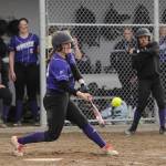 Sequims Christy Grubb crushes a pitch for a double in the Wolves 12-0 win over Forks on March 18. Sequim Gazette photo by Michael Dashiell