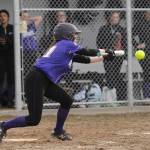 Sequims Hannah Bates drops down a bunt as Sequims Wolves knock off visiting 1A Forks 12-0 in five innings on March 18. Sequim Gazette photo by Michael Dashiell