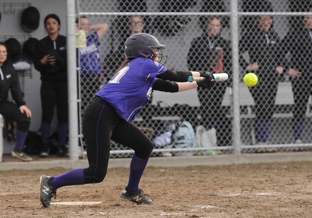 Sequims Hannah Bates drops down a bunt as Sequims Wolves knock off visiting 1A Forks 12-0 in five innings on March 18. Sequim Gazette photo by Michael Dashiell
