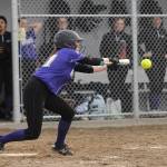 Sequims Hannah Bates drops down a bunt as Sequims Wolves knock off visiting 1A Forks 12-0 in five innings on March 18. Sequim Gazette photo by Michael Dashiell