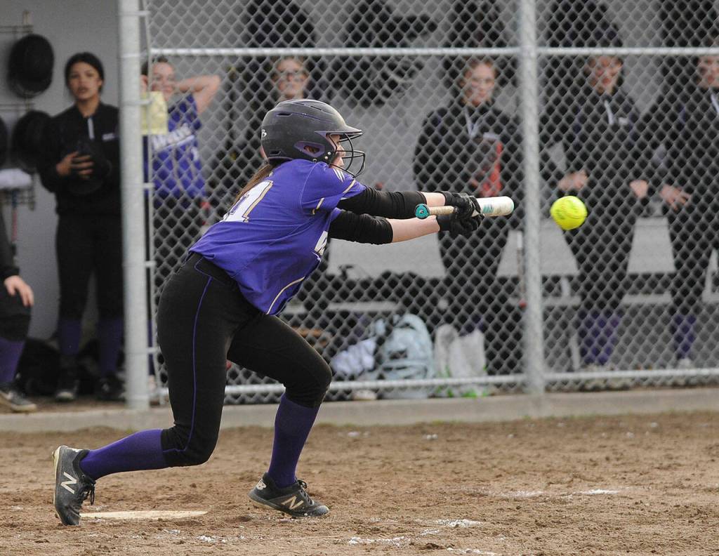 Sequims Hannah Bates drops down a bunt as Sequims Wolves knock off visiting 1A Forks 12-0 in five innings on March 18. Sequim Gazette photo by Michael Dashiell