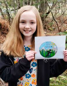 Sarah Butterworth, a student at Dry Creek Elementary School in Port Angeles, displays the design that won her the 2022 North Olympic Discovery Marathon Kids Medal Design Contest. Submitted photo