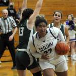 Sequim Gazette photo by Michael Dashiell
Sequims Jelissa Julmist, right, drives past Port Angeles Bailee Larson in the second half of Sequims 60-55 win over the Roughriders on Jan. 11. Julmist was named to the All-Olympic League first team.