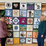 Sequim Gazette photo by Matthew Nash/ Gladis Marr and Linda Wesseler, past vice-presidents of the Sunbonnet Sue Quilt Club, worked together to piece together the clubs Community Service Quilt. They and several club members made individual blocks, too. We wanted to let people know about all the organizations we support and who in turn give back to the community, Marr said.