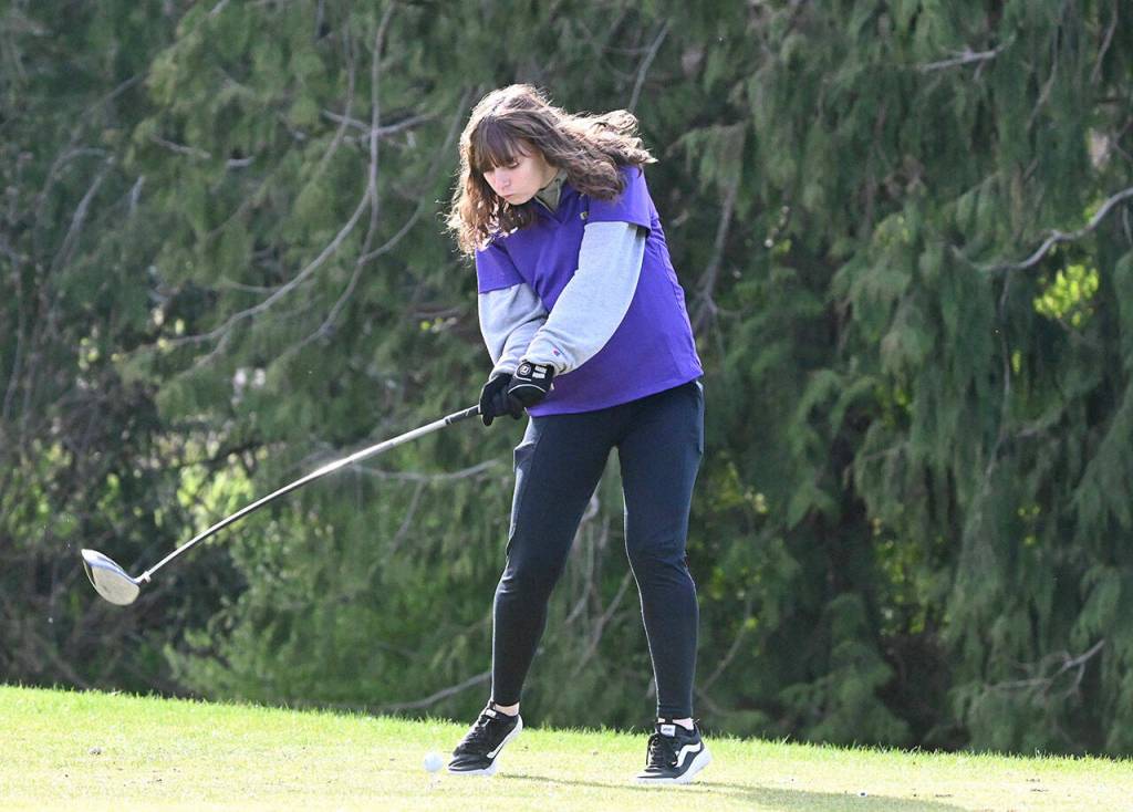 Juliana Tamblyn hits her tee shot from the second hole at The Cedars at Dungeness on March 24, an Olympic League match against North Mason. Sequim Gazette photo by Michael Dashiell