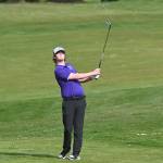 Sequims Ben Sweet hits an approach shot at the first hole of a March 24 match against North Mason at The Cedars at Dungeness. Sequim Gazette photo by Michael Dashiell