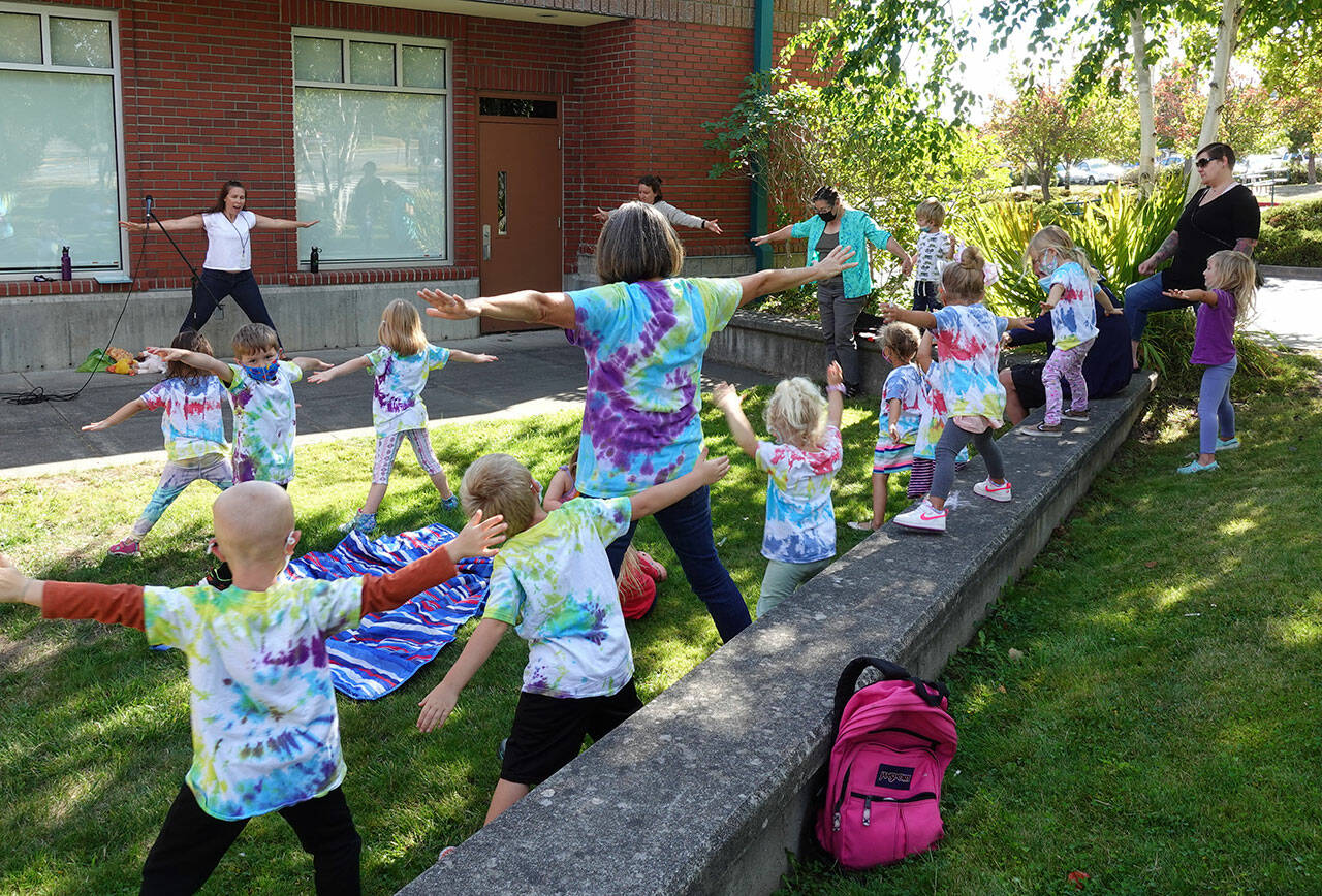 North Olympic Library System
Youths and parents enjoy a Rain or Shine! Outdoor Storytime series event at the Port Angeles Library.
