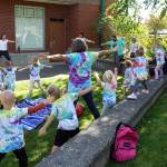 North Olympic Library System
Youths and parents enjoy a Rain or Shine! Outdoor Storytime series event at the Port Angeles Library.