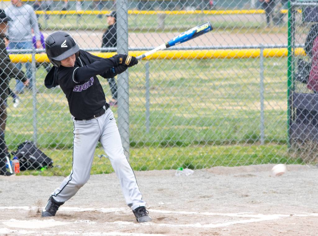Coal Seamands, 12, hits the first ball of the first game of the Sequim Little League Majors on opening day of the 2022 season on March 26. Sequim Gazette photo by Emily Matthiessen