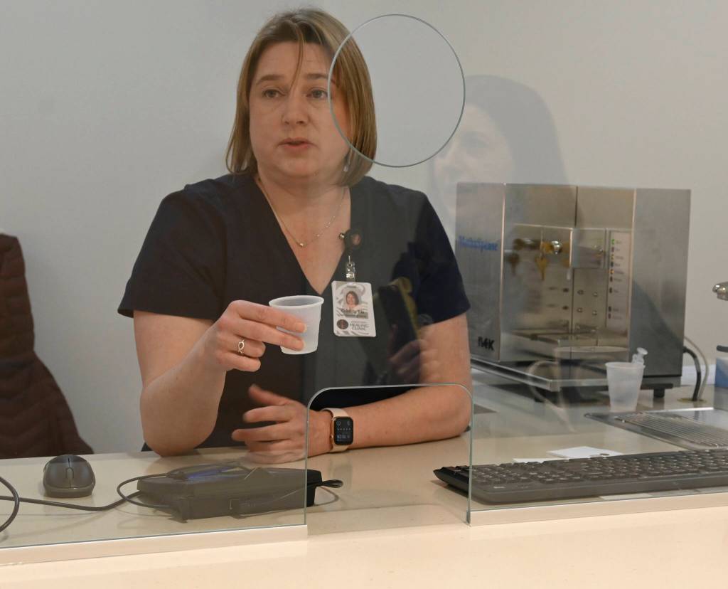 Sequim Gazette photo by Michael Dashiell/ Cristi Biddle, lead dispensing nurse, shows how she prepares a dose of methadone inside a dosing room at the Jamestown S’Klallam Tribe’s Healing Clinic.
