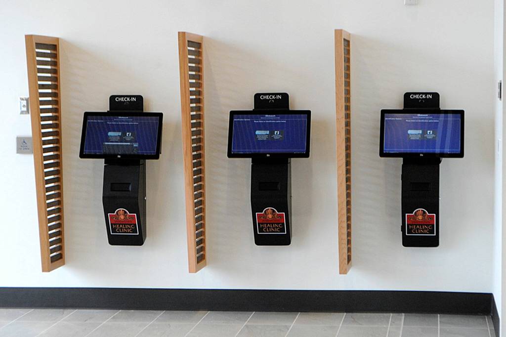 Molly Martin demonstrates the log-in system at the Healing Clinic