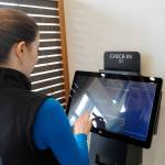 Sequim Gazette photo by Matthew Nash
Molly Martin, executive director of Healing Clinic, demonstrates the check-in system.