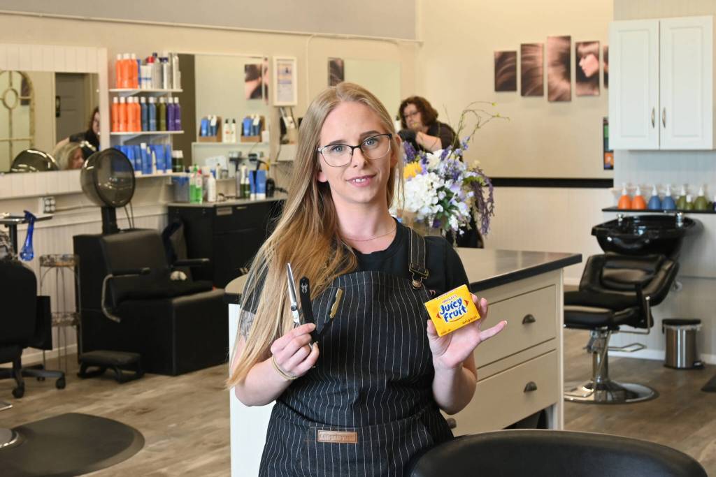 Nikhita Rogers, owner/operator of Fades and Shaves Barbering, operates her third-generation barbering business inside Sunnyside Salon at Rock Plaza in Sequim. The Juicyfruit gum? A tradition handed down to please Rogers younger clients. Sequim Gazette photo by Michael Dashiell