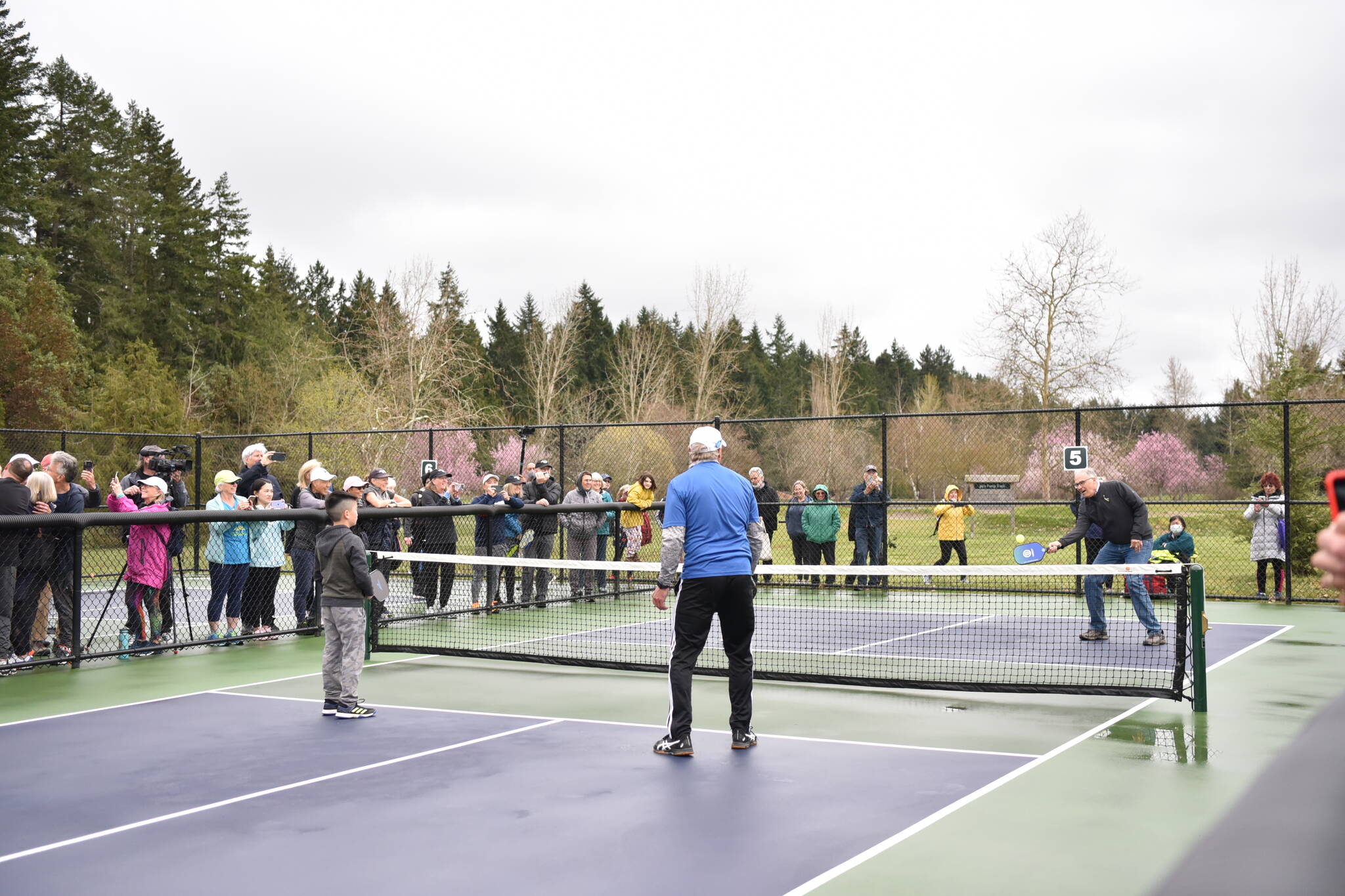 Gov. Inslee participates in an exhibition pickleball game at Battle Point Park. Photo by Nancy Treder/Bainbridge Island Review