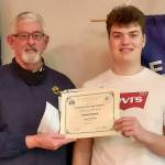 Sequim High School sophomore Keenan Green, right, accepts his Student of the Month honor (March 2022) from Sequim Elks Leading Knight Stan Dame.