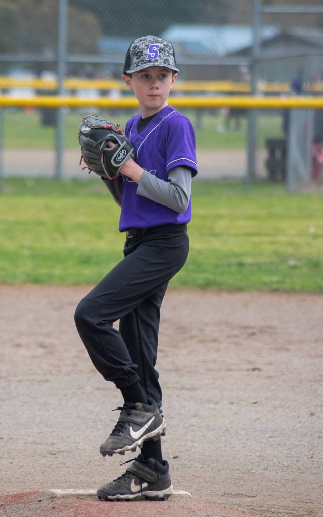 Ashton Miller, 10, pitches the first majors game of the 2022 season. Sequim Gazette photo by Emily Matthiessen