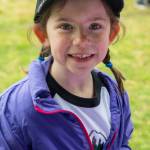 Grace Taylor, 6, participates in the excitement of opening day of Sequim Little League, her first year as a T-Ball player. Sequim Gazette photo by Emily Matthiessen
