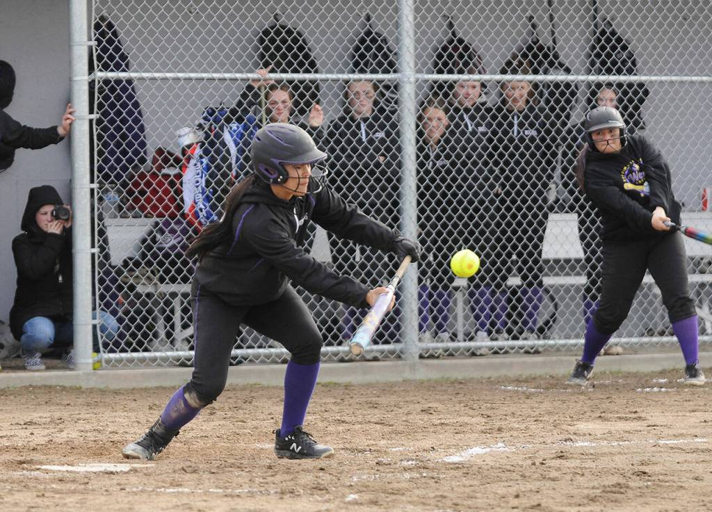 Sequims Taylee Rome lays down a successful bunt in Sequims 8-6 Olympic League loss to North Kitsap on March 29. Sequim Gazette photo by Michael Dashiell