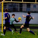 Left: Sequim goalkeeper Jack Van De Wege makes a goal-saving deflection in the first half of the Wolves 3-0 loss to Bainbridge on March 29.