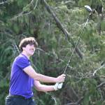 Sequim Gazette photo by Michael Dashiell
Sequims Cole Smithson watches his drive at the second hole at The Cedars at Dungeness on March 31. Smithson shot a career-best 42 as the Wolves topped Kingston by nine shots.