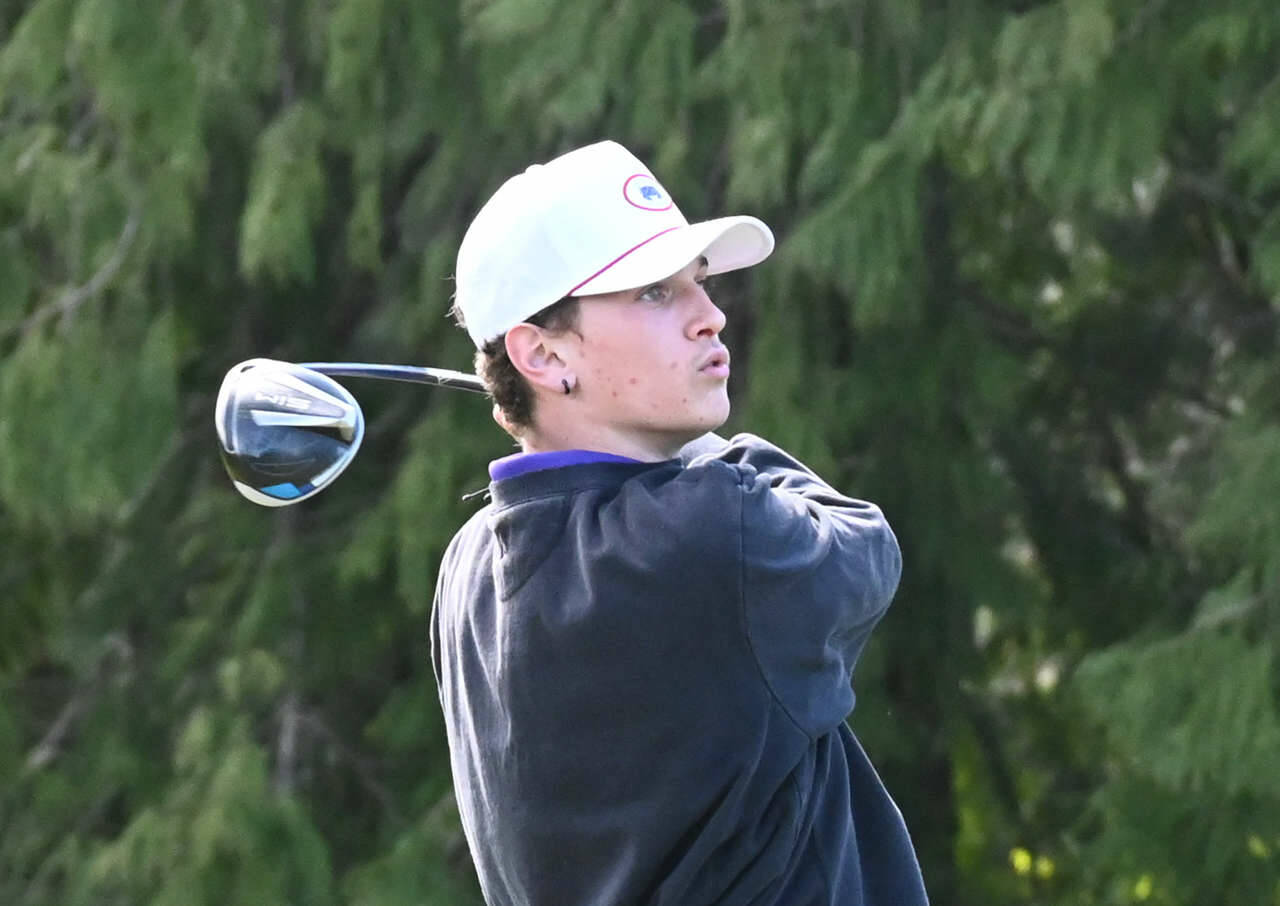 Sequims Dominic Riccobene watches his drive at the second hole at The Cedars at Dungeness on March 31. Riccobene shot a 39 as the Wolves topped Kingston by nine shots. Sequim Gazette photo by Michael Dashiell