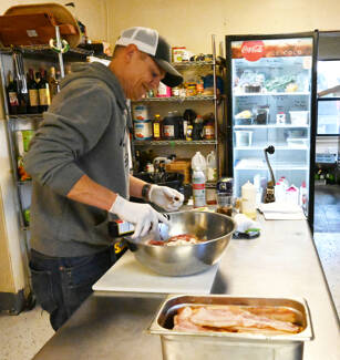Co-owner Josh Washburn preps food in the Sunshine Café kitchen last week. Sequim Gazette photo by Michael Dashiell