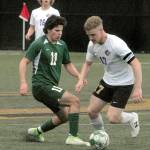 Photos by Keith Thorpe/Olympic Peninsula News Group
Port Angeles Xander Maestas, left, and Sequims Aidan Henninger face off for ball control as Sequims Harrison Bell looks on during an April 12 Olympic League match at Peninsula College in Port Angeles.
