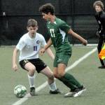 Photo by Keith Thorpe/Olympic Peninsula News Group
Sequims Ethan Knight, left, tries to keep the ball inbounds as Port Angeles Dayton Williams waits to take control on April 12 at Peninsula College.