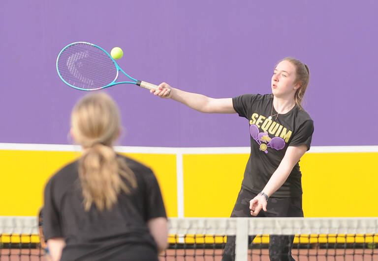 Sequim Gazette photo by Michael Dashiell
Sequims Malory Morey, right, returns a shot in a doubles match against North Kitsap on April 14 in Sequim. Morey and doubles partner Jordan Hegvedt downed North Kitsaps Amber Amos and Kate Ryan, 6-3 and 6-2.