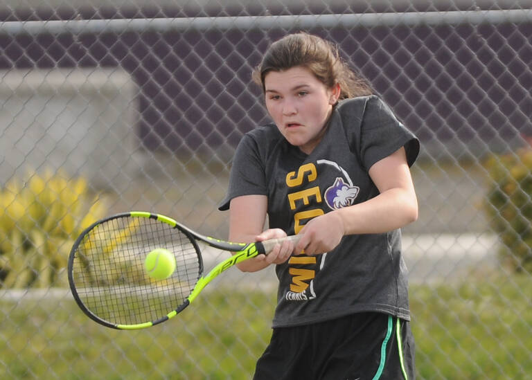 Sequims Allie Gale returns a shot against North Kitsaps Teegan DeVries in an April 14 league match.