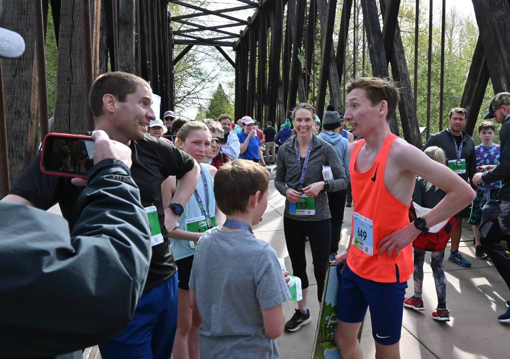 Langdon Larson of Port Angeles, right, celebrates his Railroad Bridge 10k win in Sequim with family members, many of who also competed. Sequim Gazette photo by Michael Dashiell